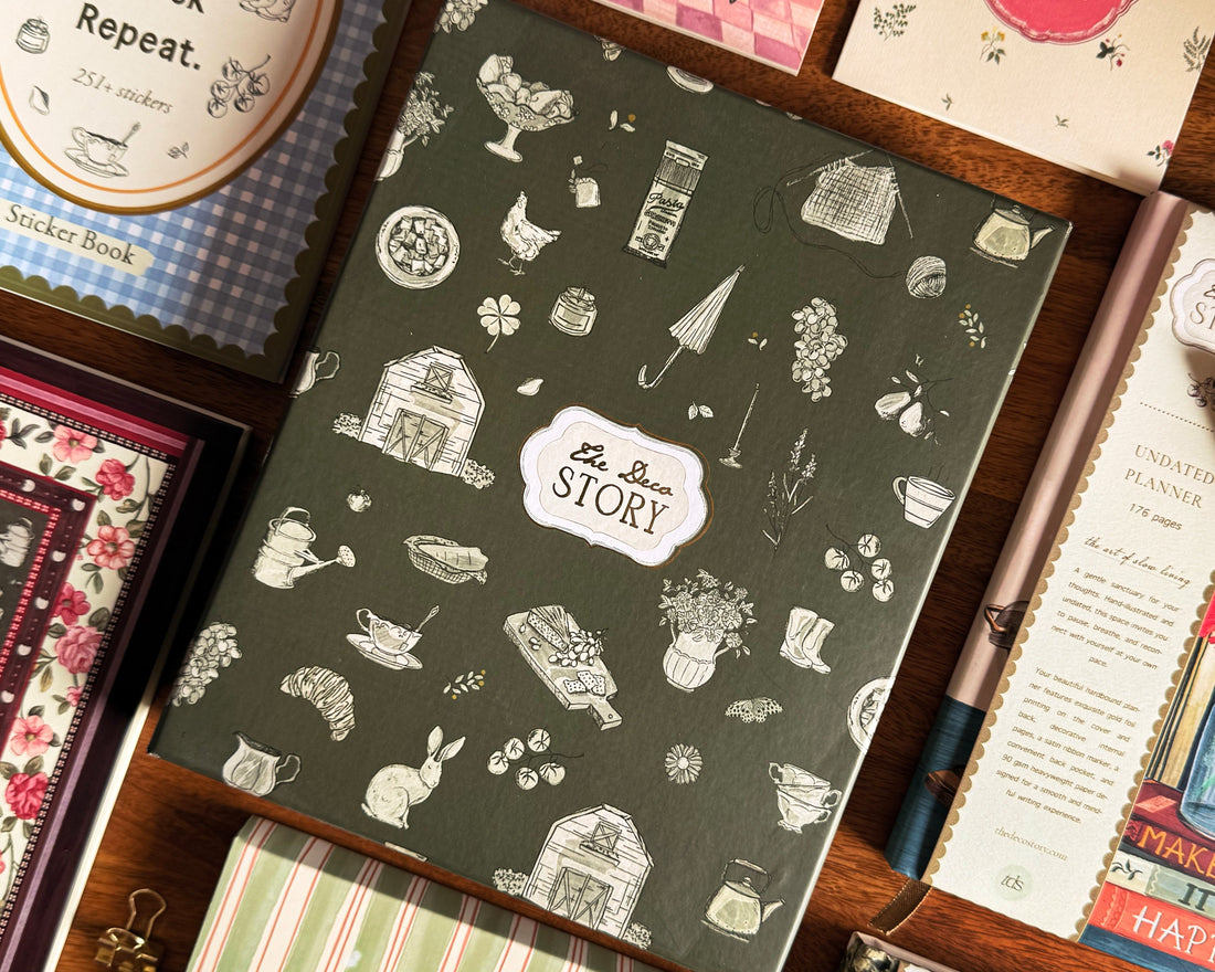 Close-up of a hand-painted floral hardbound journal on a wooden desk, perfect for intentional Valentine’s Day gifting and slow living