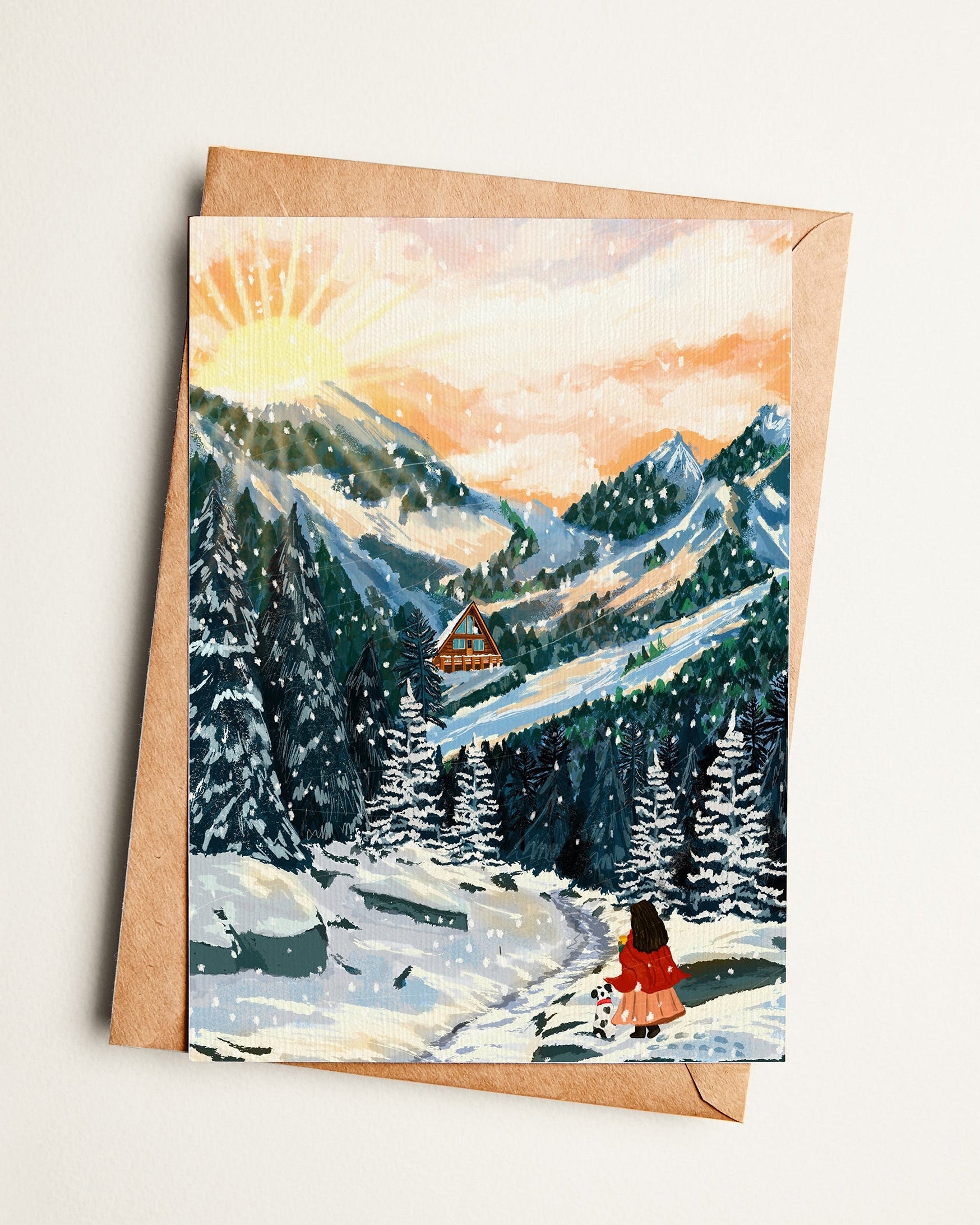 Greeting card with a winter landscape painting featuring a person in a red coat walking through a snowy forest.