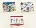 Three Christmas-themed greeting cards on a light beige background