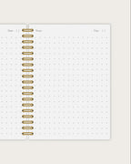 dotted notebook with gold spiral 