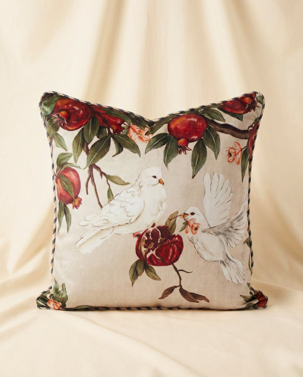 Decorative pillow with dove duo and pomegranates on a beige background