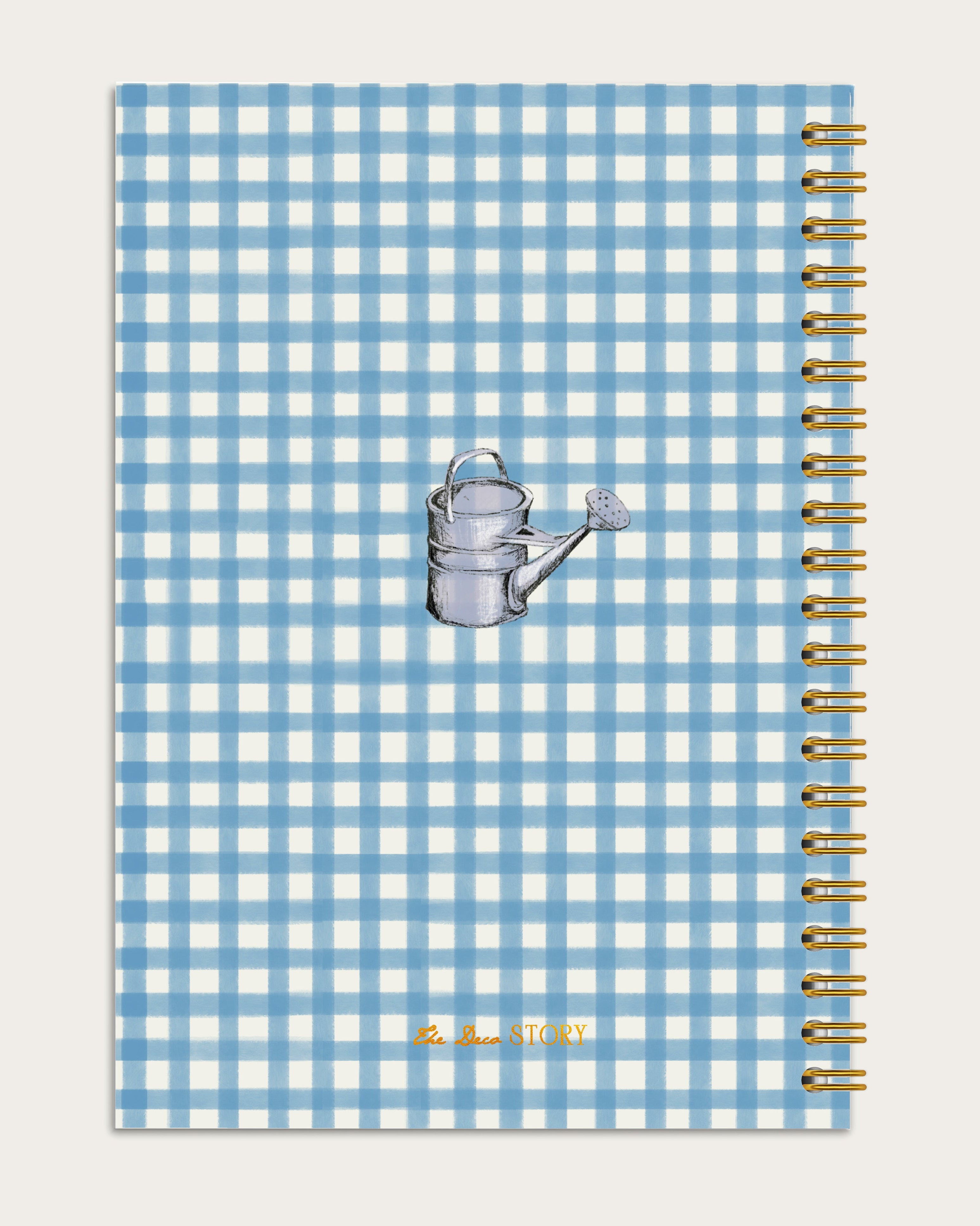 Notebook with blue and white checkered cover featuring a watering can illustration, on a light gray background.