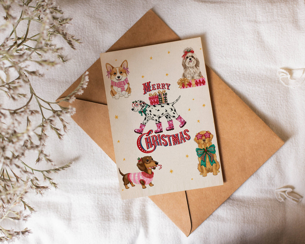 Cute Christmas card with dog illustrations on a white surface