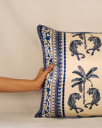 A celebration of strength and serenity, the Palm Royale cushion captures the spirit of Luna Sol Soirée—where bold meets calm. Featuring hand-drawn tigers encircling a tropical palm, framed with intricate borders in timeless blue and ivory, it’s a piece that feels both regal and grounded.
Crafted in rich, soft fabric with impeccable attention to detail, this cushion brings a refined touch of artistry and elegance to your living space—perfect for those who love a blend of classic charm and modern design.