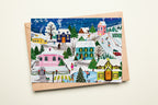 Christmas card with a winter village scene on a white background