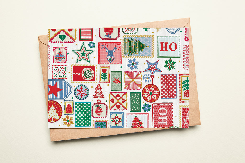 Christmas-themed envelope with patterned design on a beige background