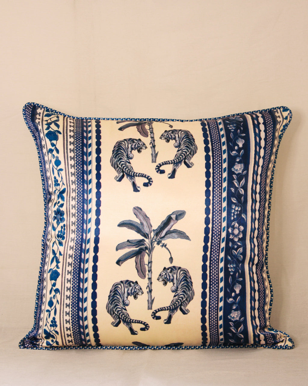 A celebration of strength and serenity, the Palm Royale cushion captures the spirit of Luna Sol Soirée—where bold meets calm. Hand-drawn tigers encircle a tropical palm, framed in intricate blue borders. Crafted in premium fabric, it adds artful elegance to your home.