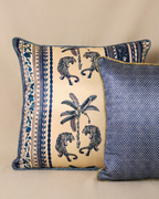 Decorative pillows with tiger and palm tree pattern on a beige background
