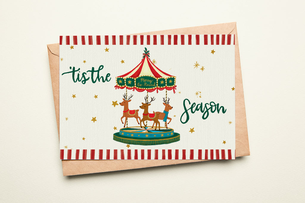 Christmas card with reindeer and striped envelope on a beige background