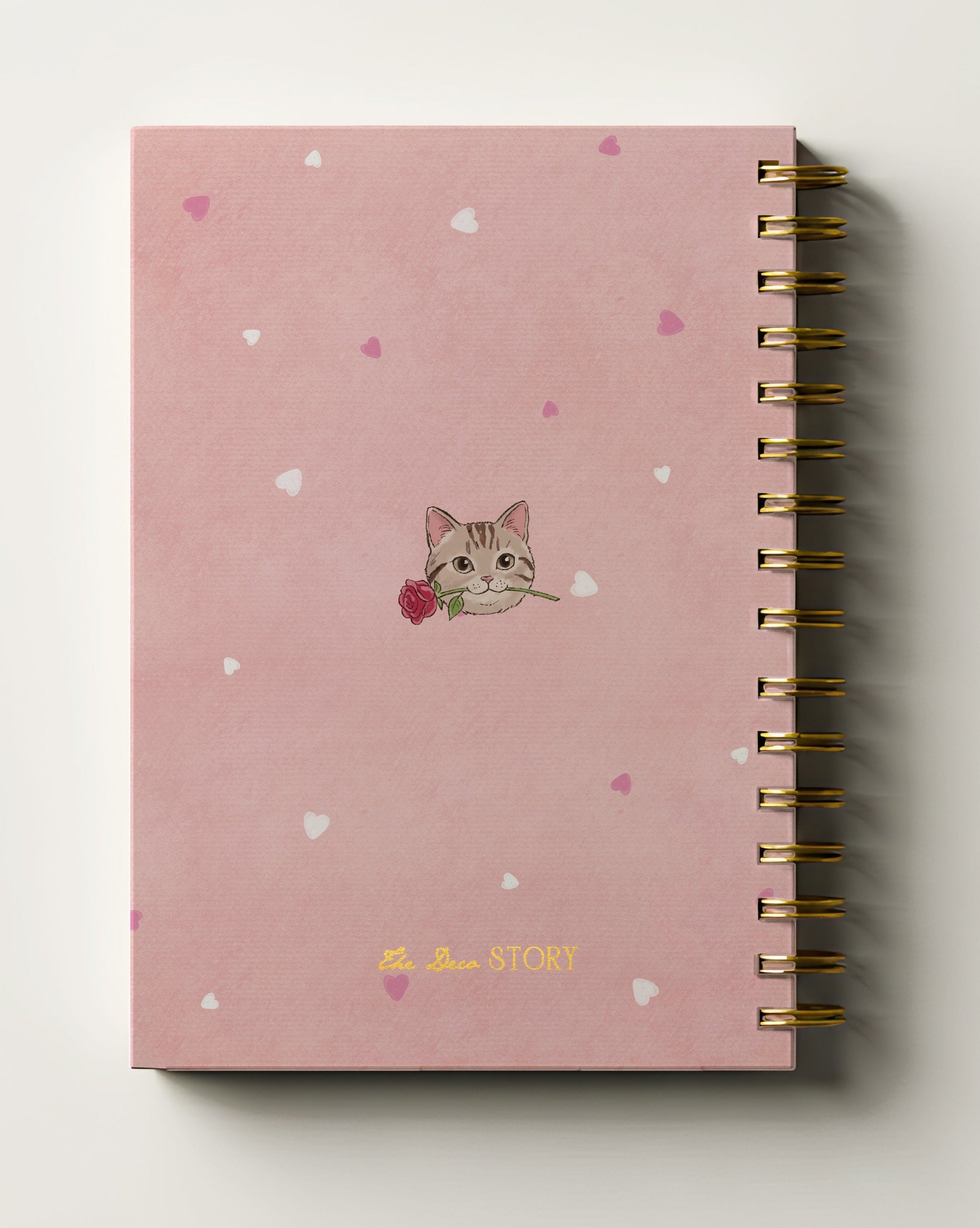 Pink journal with cat illustration and heart patterns on a white background