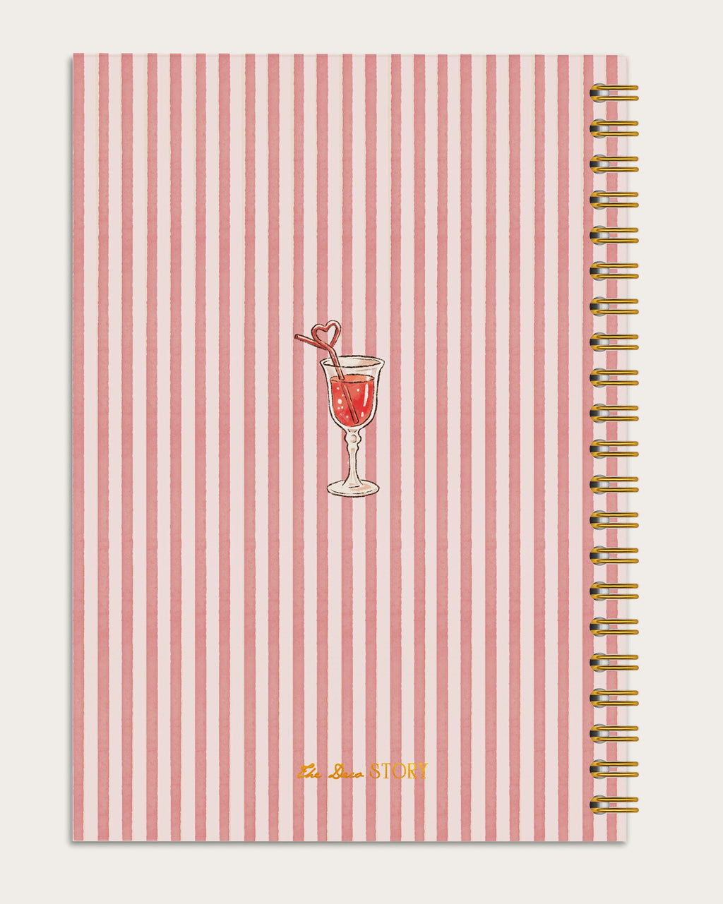 Notebook with red and white striped cover featuring a cocktail illustration on a light gray background