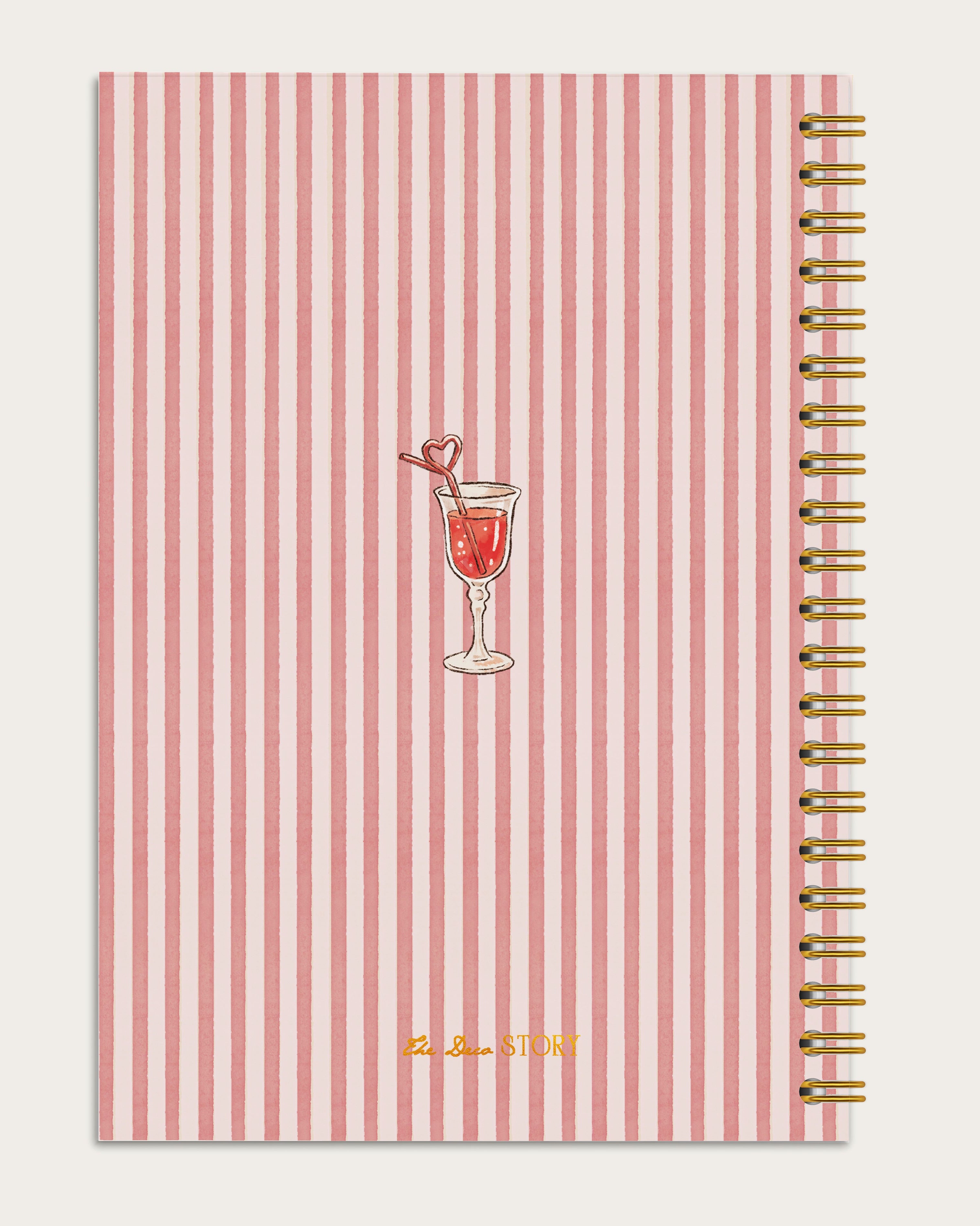 Notebook with red and white striped cover featuring a cocktail illustration on a light gray background