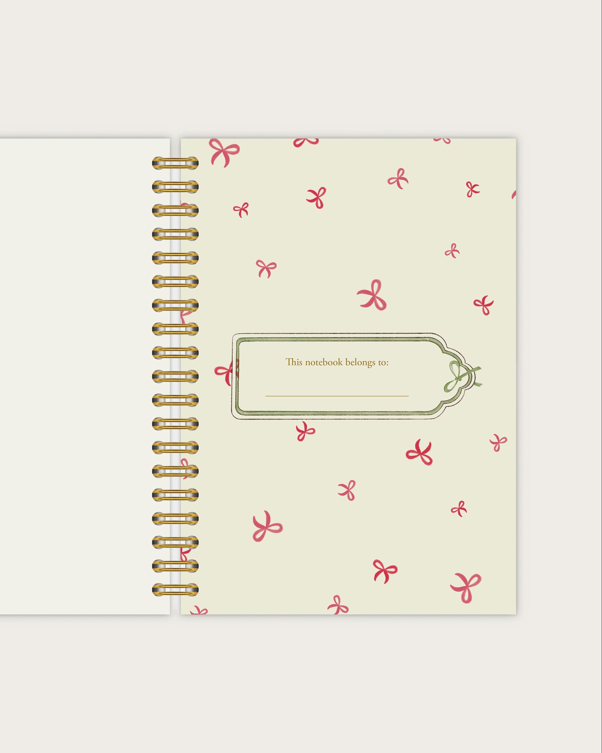 Spiral-bound notebook with decorative cover on a light gray background