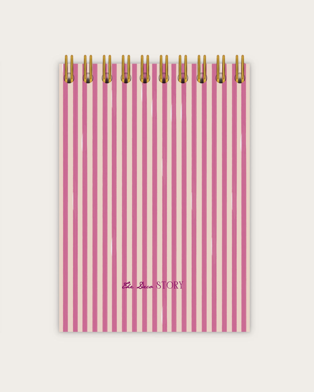 Pink striped notebook with gold wire binding on a white background
