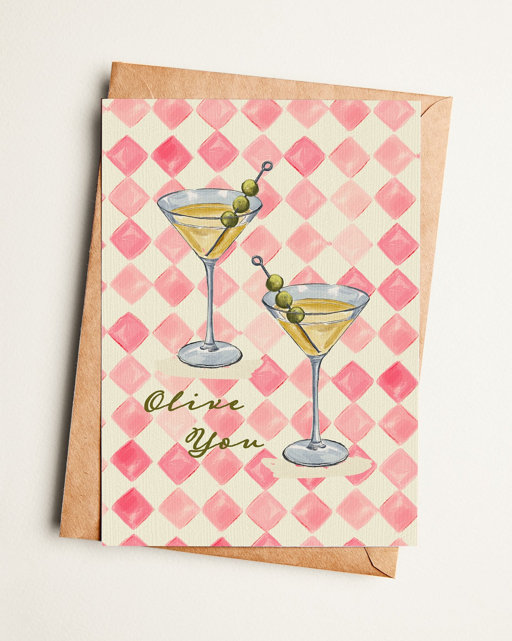 Greeting card with martini illustration and 'Olive You' text on a pink checkered background