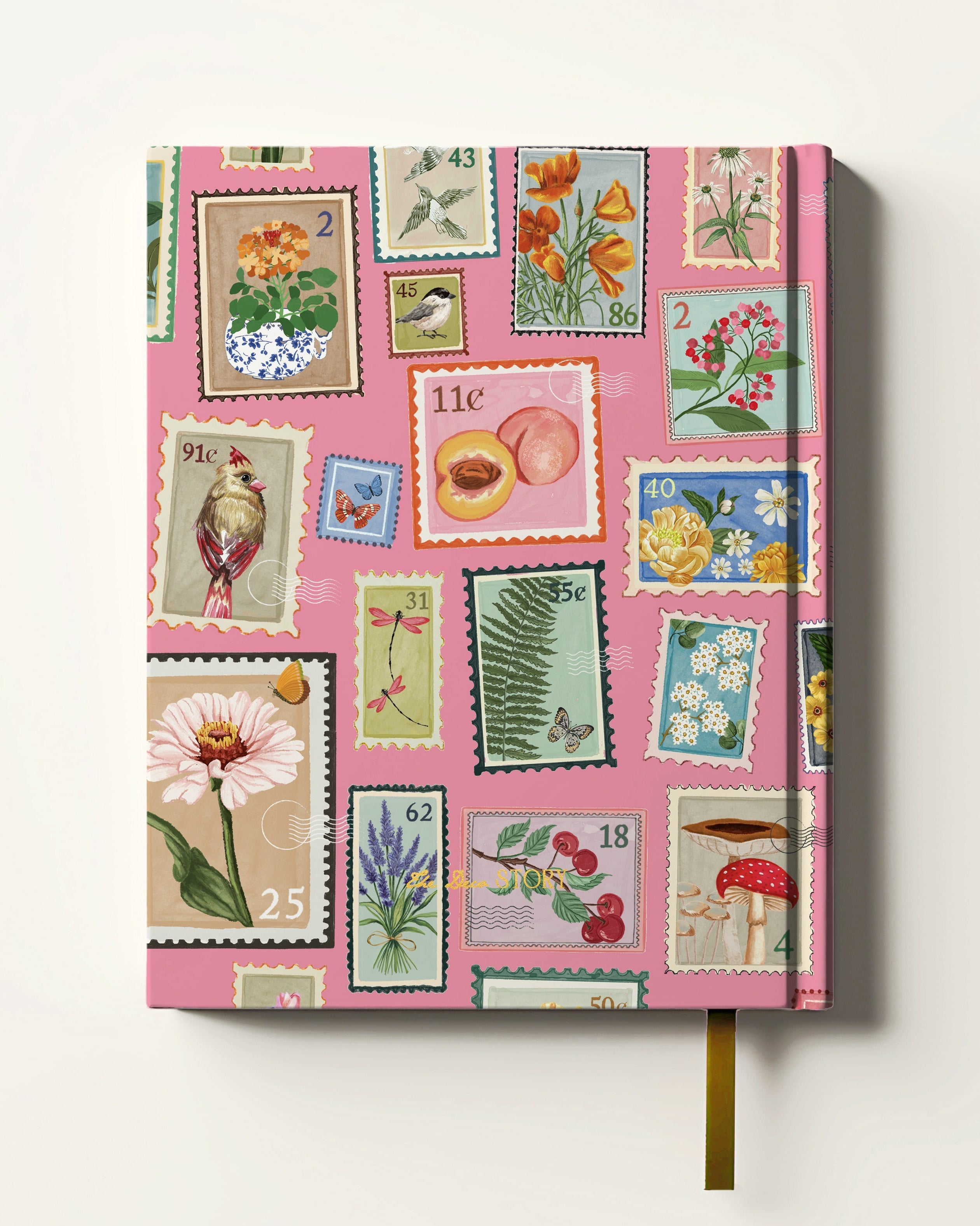 Notebook with vintage stamp design on a pink cover against a white background