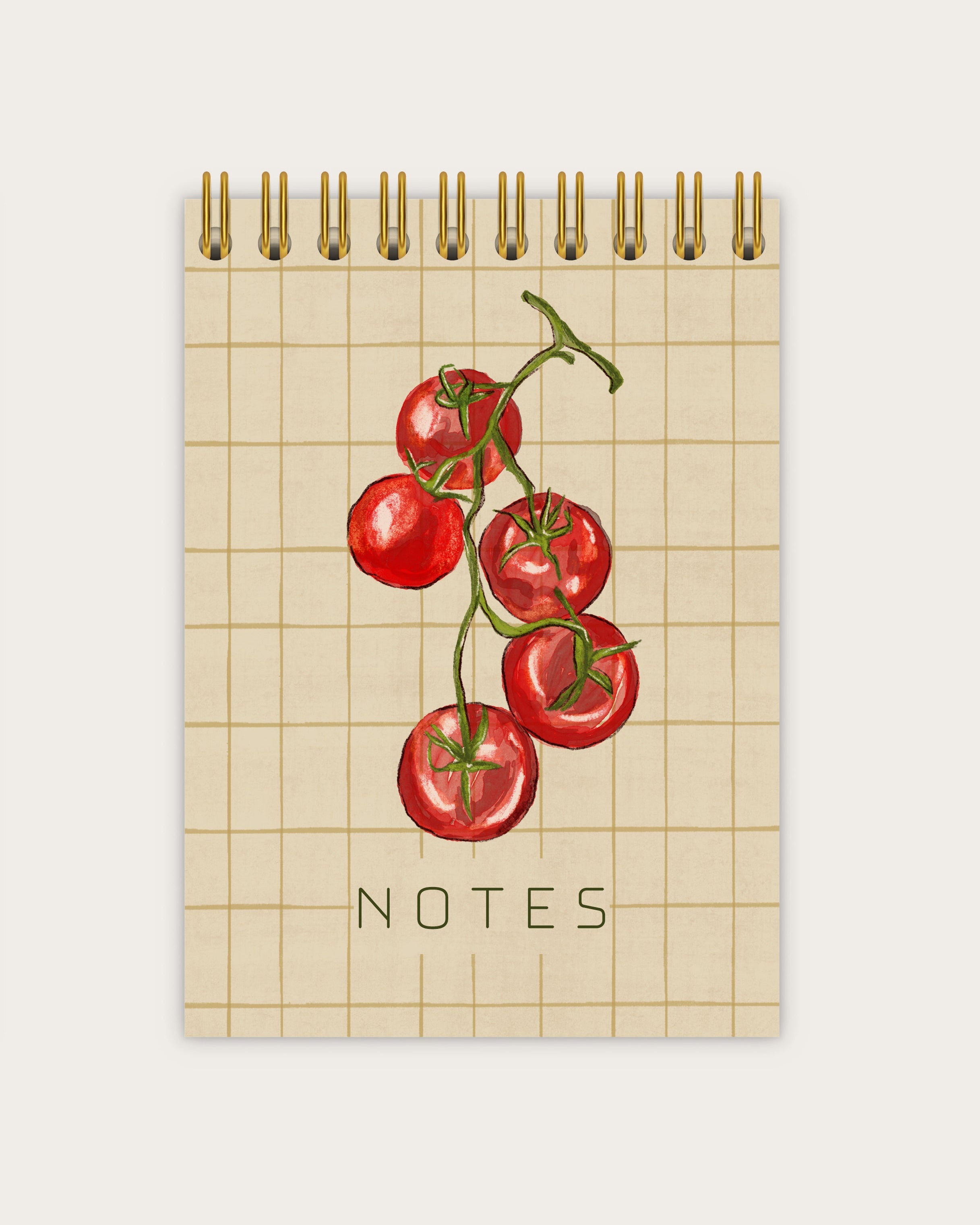 Notebook with red tomatoes illustration and 'NOTES' text on a grid background